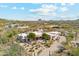 Aerial view of home with desert landscaping, tile roof, and mountain views at 6432 E Old Paint Trl, Carefree, AZ 85377