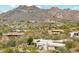 Aerial view of desert neighborhood, home with desert landscaping and mountain views at 6432 E Old Paint Trl, Carefree, AZ 85377