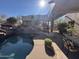 Backyard pool with patio and landscaping, perfect for outdoor relaxation and entertaining guests at 6432 E Old Paint Trl, Carefree, AZ 85377