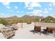 Outdoor balcony with seating offering expansive mountain views under a blue sky at 6432 E Old Paint Trl, Carefree, AZ 85377