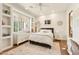 Inviting bedroom showcasing natural light, a comfortable bed, a decorative rug, and a writing desk at 6432 E Old Paint Trl, Carefree, AZ 85377