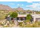 Exterior front view of home with desert landscaping and mountain backdrop at 6432 E Old Paint Trl, Carefree, AZ 85377