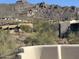 Desert homes with hill views, complemented by native vegetation at 6432 E Old Paint Trl, Carefree, AZ 85377