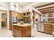 Kitchen with modern appliances, spacious island, and rustic design elements at 6432 E Old Paint Trl, Carefree, AZ 85377