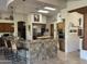 Spacious kitchen boasts an island, tile floors, skylights, and breakfast bar seating at 6432 E Old Paint Trl, Carefree, AZ 85377