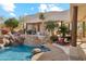 Spectacular pool area with rock waterfall, slide, and lush landscaping, creating a private and luxurious retreat at 6432 E Old Paint Trl, Carefree, AZ 85377