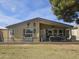 Inviting backyard with a covered patio, stylish decor, and a well-kept lawn, perfect for outdoor entertaining at 650 N Hawes Rd # 2852, Mesa, AZ 85207