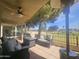 Relax on the covered patio with comfortable seating and views of the community golf course at 650 N Hawes Rd # 2852, Mesa, AZ 85207