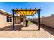 Paver patio with pergola featuring a grill and view of the covered patio at 6543 E Preston St, Mesa, AZ 85215