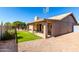 Backyard with covered patio, artificial turf, and gravel landscaping at 6543 E Preston St, Mesa, AZ 85215