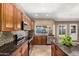 This gourmet kitchen features granite counters, mosaic backsplash, and stainless appliances for a modern look at 6543 E Preston St, Mesa, AZ 85215