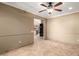 This bright living space boasts neutral walls and tile flooring, providing a view into the kitchen at 6543 E Preston St, Mesa, AZ 85215