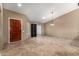 Bright living room with tile floors, recessed lighting, and a decorative hanging light fixture at 6543 E Preston St, Mesa, AZ 85215