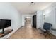 Neutral walls and tile floors grace this living area, providing a clean view into an adjacent kitchen at 6543 E Preston St, Mesa, AZ 85215