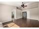 Spacious main bedroom showcasing double doors, an archway, and hardwood flooring at 6543 E Preston St, Mesa, AZ 85215