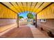 Covered patio with pavers and sun shades creates a private outdoor living space at 6543 E Preston St, Mesa, AZ 85215