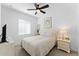 Neutral bedroom with natural light, ceiling fan, and modern decor at 759 E Zesta Ln # 104, Gilbert, AZ 85297