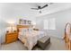 Cozy bedroom with neutral tones, decorative headboard, and ample natural light at 759 E Zesta Ln # 104, Gilbert, AZ 85297