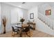 Inviting dining area with natural light, a round table, and a jute rug, creating a cozy atmosphere at 759 E Zesta Ln # 104, Gilbert, AZ 85297