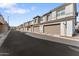 Row of townhomes with a two car garage and a neutral color scheme at 759 E Zesta Ln # 104, Gilbert, AZ 85297