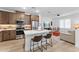 Modern kitchen with a quartz countertop island and stainless steel appliances open to the living room at 759 E Zesta Ln # 104, Gilbert, AZ 85297