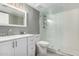 The bathroom features a walk-in shower with glass door, a modern vanity, and updated lighting at 7830 E Camelback Rd # 108, Scottsdale, AZ 85251