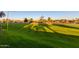 Expansive view of lush golf course with manicured greens and mature trees casting shadows at 7830 E Camelback Rd # 108, Scottsdale, AZ 85251