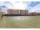 Outdoor tennis courts with residential buildings in background under sunny sky at 7830 E Camelback Rd # 108, Scottsdale, AZ 85251