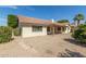 Backyard features low-maintenance gravel, mature trees, and a covered patio, enhancing outdoor enjoyment at 817 E Meadow Ln, Phoenix, AZ 85022