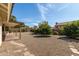 The backyard features rock landscaping, a stone path, and covered patio at 817 E Meadow Ln, Phoenix, AZ 85022