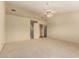 Expansive bedroom with neutral carpet, a ceiling fan, and ample space for relaxation and personalization at 817 E Meadow Ln, Phoenix, AZ 85022