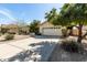 Single-story home with a two-car garage, concrete driveway, desert landscaping, and a red tile roof at 817 E Meadow Ln, Phoenix, AZ 85022