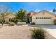 Charming single-story home with desert landscaping, two-car garage, and a red tile roof in a sunny neighborhood at 817 E Meadow Ln, Phoenix, AZ 85022