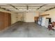 Spacious garage featuring a large, open area and ample storage, suitable for parking and projects at 817 E Meadow Ln, Phoenix, AZ 85022