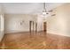 Spacious living room featuring vaulted ceilings, hardwood floors, and a ceiling fan at 817 E Meadow Ln, Phoenix, AZ 85022