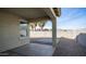 Back patio with a covered concrete patio, rock ground cover, and palm tree views at 821 S Parker Pl, Casa Grande, AZ 85122