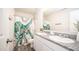 Bathroom featuring double sinks, white cabinets, and a shower with an octopus curtain at 821 S Parker Pl, Casa Grande, AZ 85122