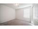 Bedroom featuring carpet, a window with blinds, a closet, and overhead lighting at 821 S Parker Pl, Casa Grande, AZ 85122