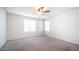 Spacious bedroom featuring neutral carpet, a ceiling fan, and lots of natural light at 821 S Parker Pl, Casa Grande, AZ 85122