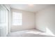 Bright bedroom with a large window, plush carpet, and a spacious closet at 821 S Parker Pl, Casa Grande, AZ 85122