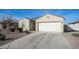 Well-maintained single-story home with a two-car garage, desert landscaping, and a concrete driveway at 821 S Parker Pl, Casa Grande, AZ 85122