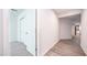 Hallway with wood-style floors and a view of a bedroom with carpet and closet at 821 S Parker Pl, Casa Grande, AZ 85122