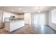 Open-concept kitchen with stainless steel appliances and a view of the dining area at 821 S Parker Pl, Casa Grande, AZ 85122