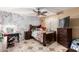 Bedroom featuring a ceiling fan, window, and a comfortable bed and beautiful decor at 8305 W Pioneer St, Tolleson, AZ 85353