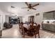 Open dining room with a large table, blending seamlessly with the living space and kitchen area at 8305 W Pioneer St, Tolleson, AZ 85353