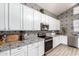 Well-equipped kitchen showcasing ample cabinetry, elegant countertops, and contemporary appliances at 8305 W Pioneer St, Tolleson, AZ 85353