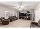 Cozy living room features tile floors, neutral walls, and a statement wall with a decorative pattern at 8305 W Pioneer St, Tolleson, AZ 85353