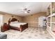 Main bedroom showcasing decorative tiled flooring, neutral walls, and a ceiling fan at 8305 W Pioneer St, Tolleson, AZ 85353