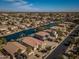 High-angle shot of a community along waterways, beautiful homes, and manicured yards on a clear day at 856 E Indian Wells Pl, Chandler, AZ 85249