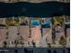 A birds eye view showing backyard pools in a neighborhood along a waterway featuring beautiful landscaping at 856 E Indian Wells Pl, Chandler, AZ 85249